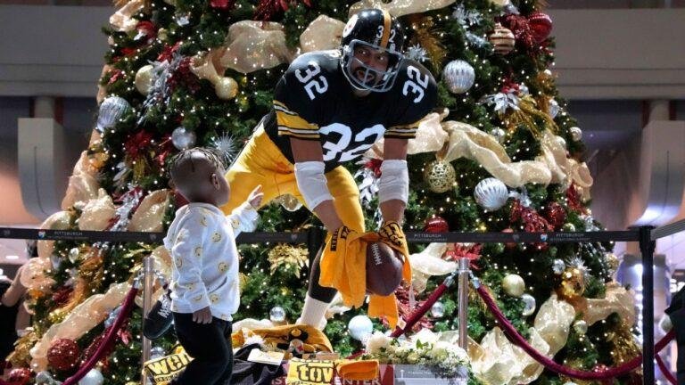 Franco Harris and the world's biggest Pittsburgh Steelers fan